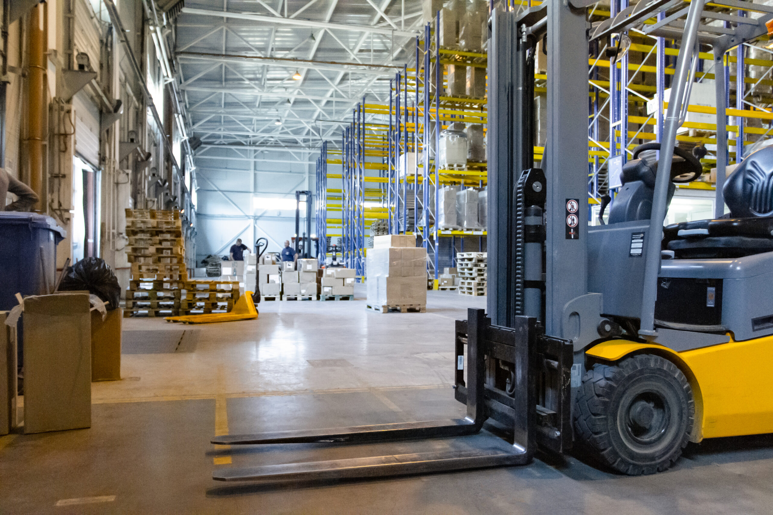 Interior Of A Modern Warehouse With Forklifts. Pallet Stacker Tr warehouse